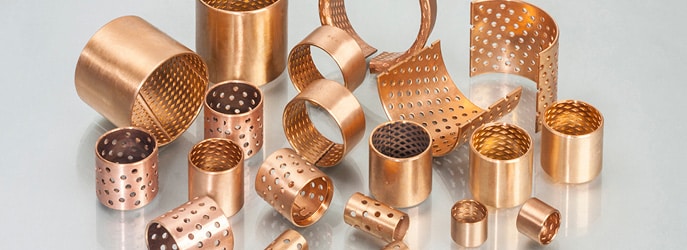 Lubricating holes for wrapped bronze bushings (CuSn8) bearings and similarly are wrapped of a cold formable homogenous bronze (CuSn8)